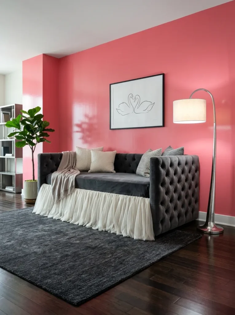 "Tufted velvet daybed with gathered tulle skirt against a glossy pink wall"