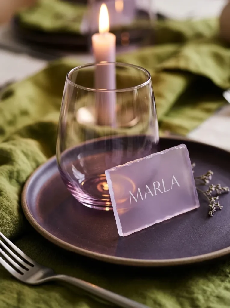  "Aubergine plate with a frosted lilac acrylic place card on pistachio linen"