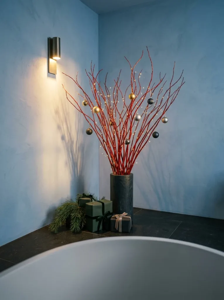 "Poppy-red lacquered willow branch in a soapstone vessel beside a bathtub"